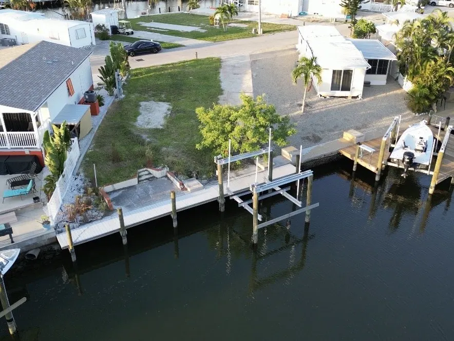 Aerial view of the lot at 3853 Cherry Lane with new dock and boat lift