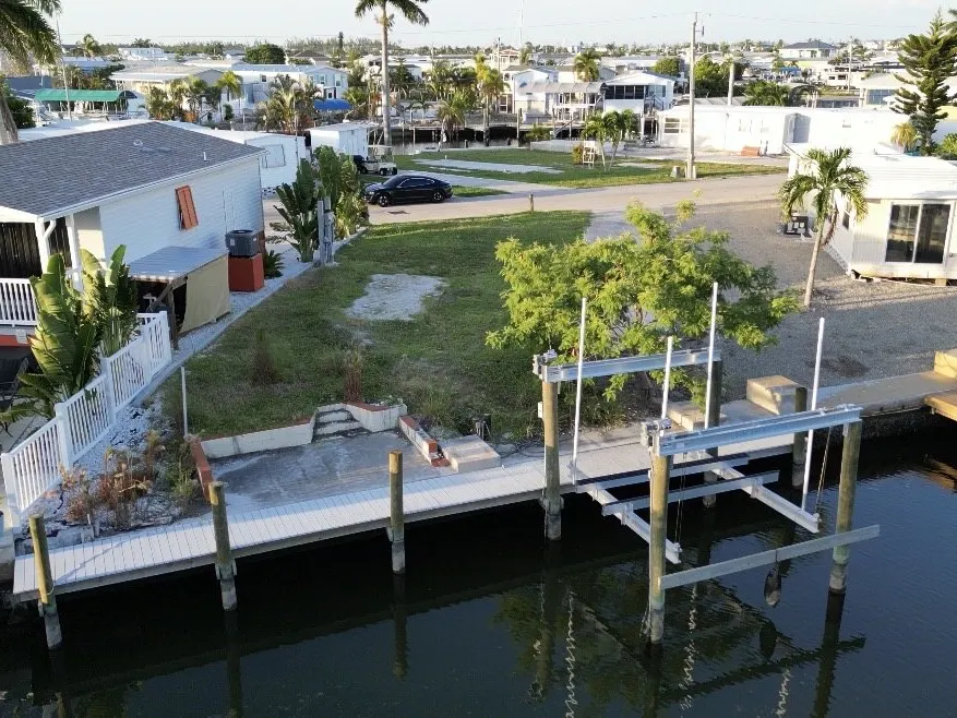 Aerial of the dock and neighboring homes