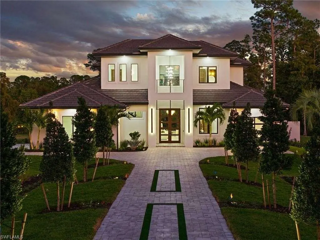 Front entrance at dusk with lit walkway